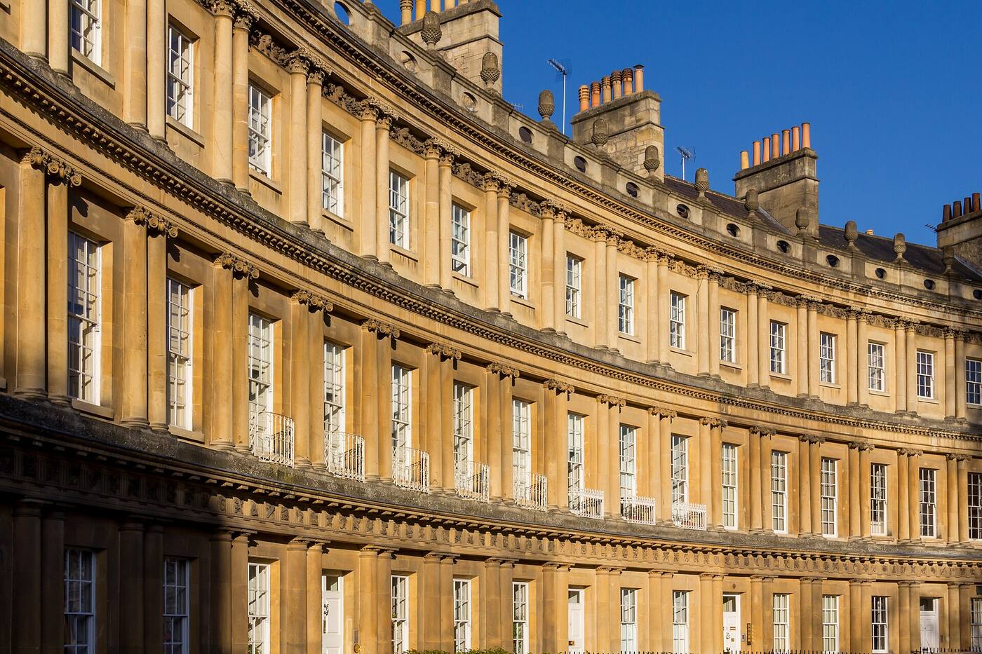 The sweeping curve of the Royal Crescent's Georgian façade on a sunny day